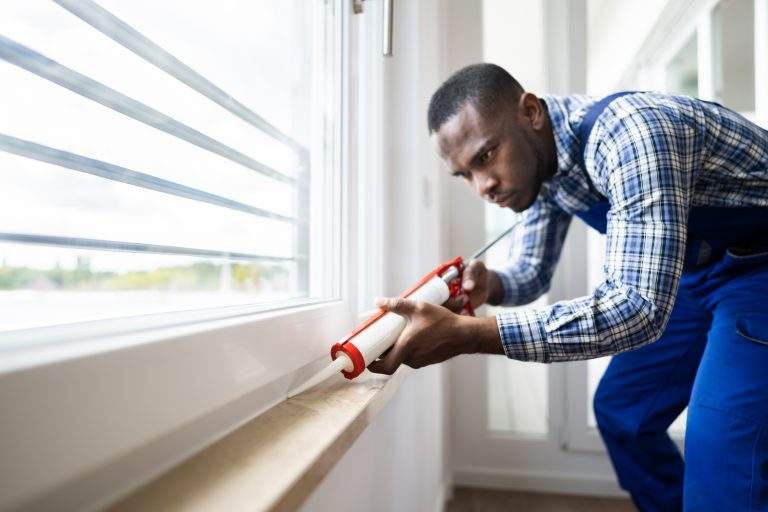 Caulk Sealant Application. Silicone Window Seal And Waterproofing